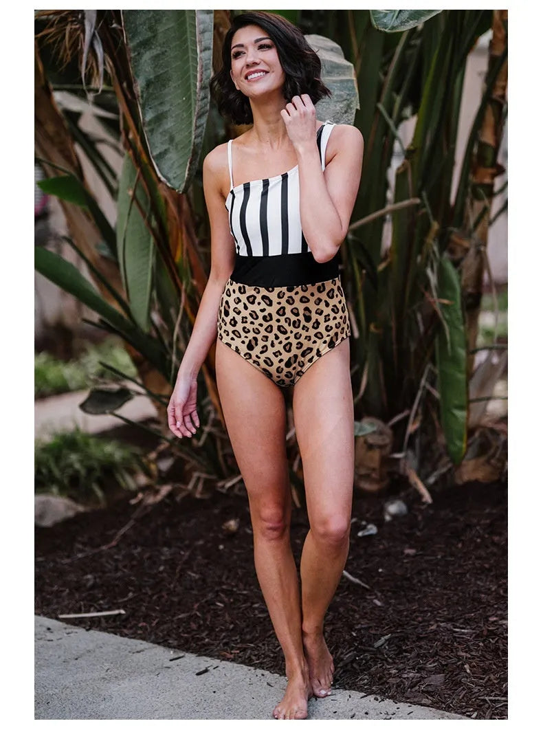Leopard print women's one-piece swimsuit with an asymmetrical collar and high-waist briefs style.