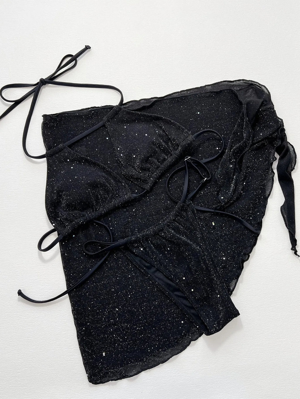 Black three-piece bikini swimsuit with matching top and shorts