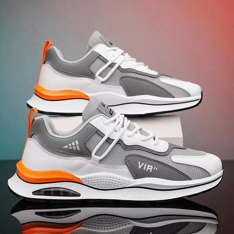 Men's gray mesh running shoes with round toe and middle top height on white background