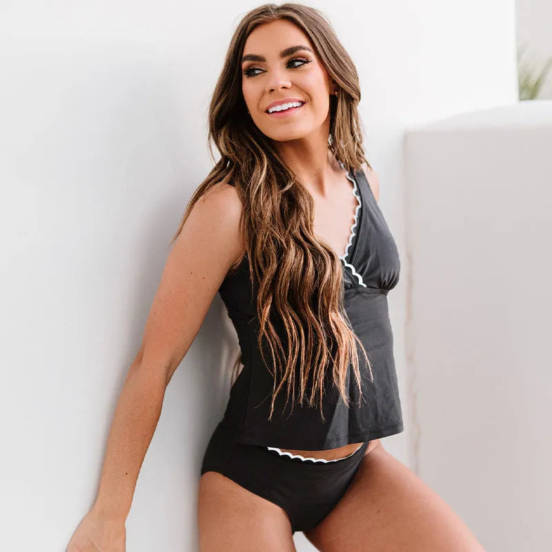 Black sleeveless women's bikini swimsuit made from nylon fabric, showing top and bottom pieces