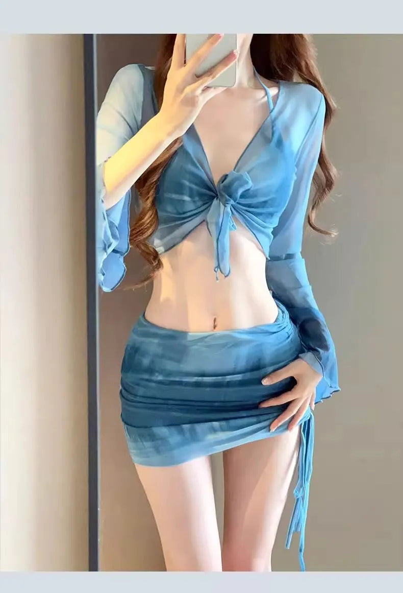 Women's blue high-waisted bikini four-piece swimsuit set showing shirt, bra, underwear and skirt components
