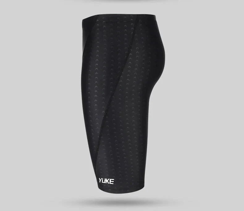 Men's black polyester swimming trunks set with anti-fog goggles, waterproof cap, ear plugs, nose clip, and carry bag.