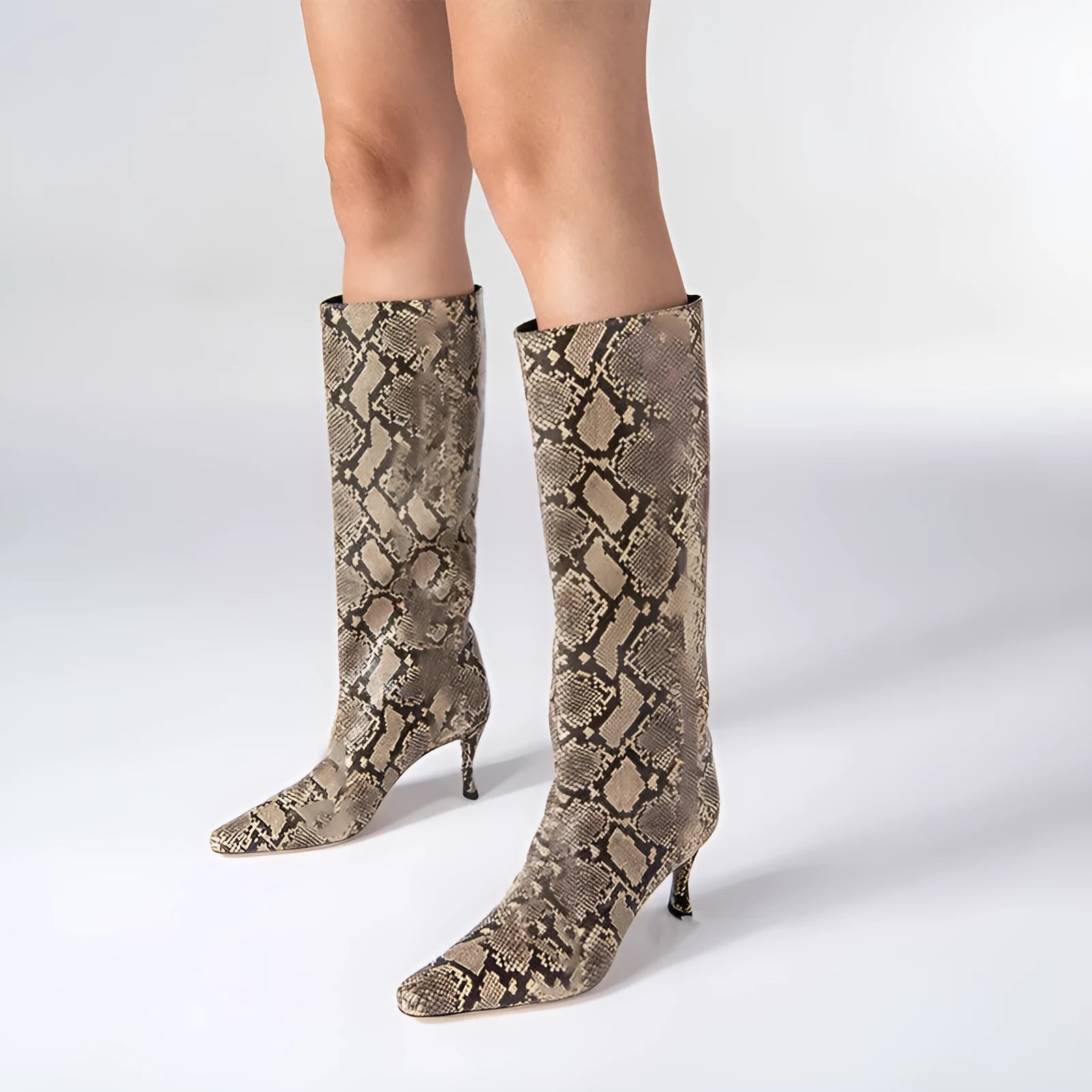 Women's square toe ankle cowboy boots in various colours on a neutral background.