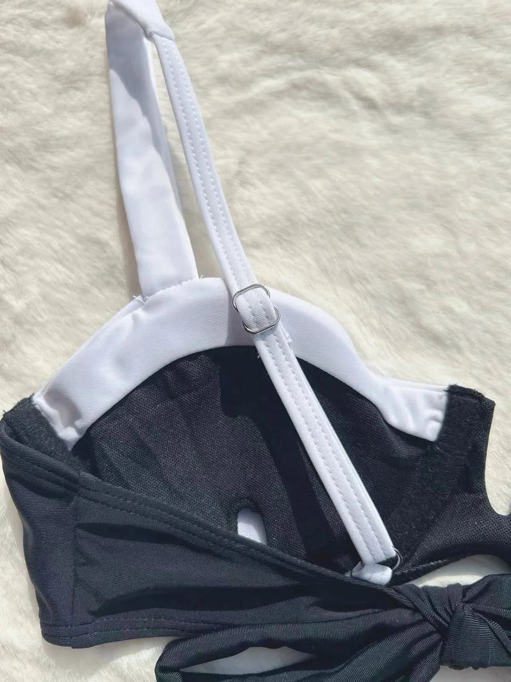 Black low waist bikini swimsuit with stitching split detail and briefs style cut