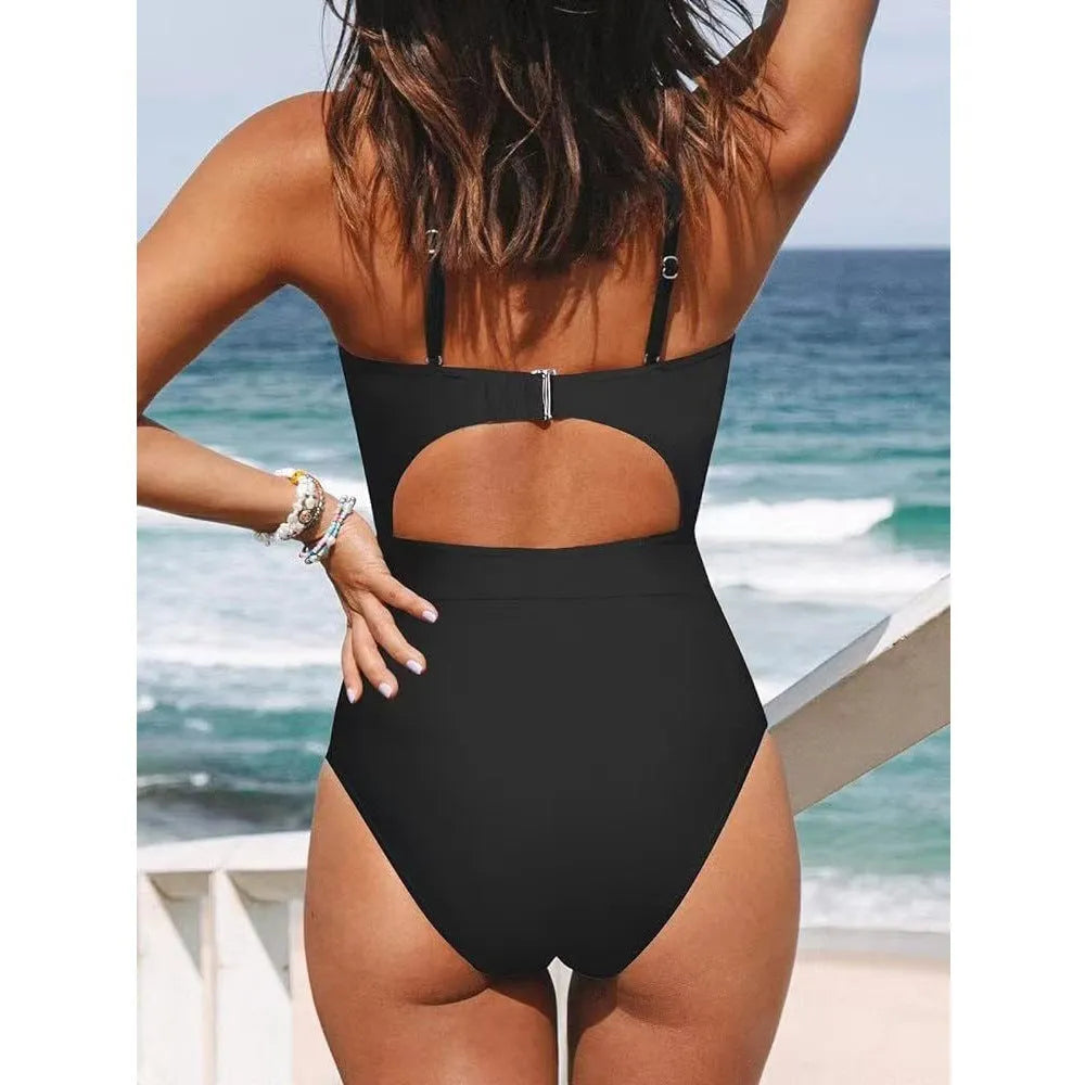 Women's solid colour cross-back one-piece swimsuit in black, red, or blue.