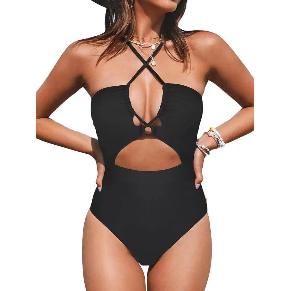 Women's solid colour cross-back one-piece swimsuit in black, red, or blue.