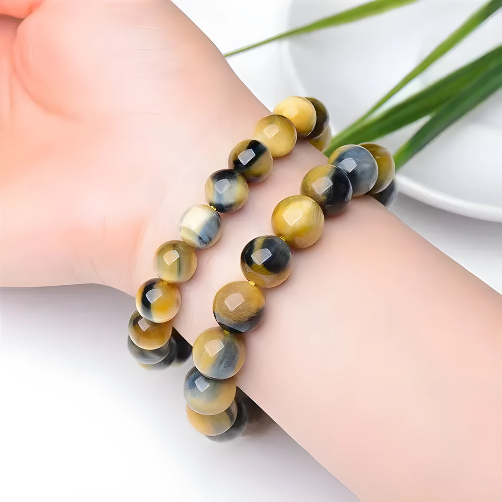 Natural fantasy tiger eye agate bracelet with round geometric beads on a wrist
