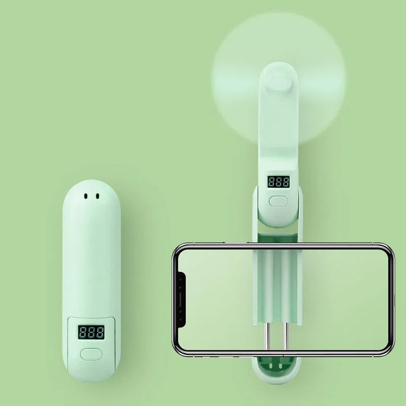 Folding mini USB desk fan in green showing compact folded and unfolded positions