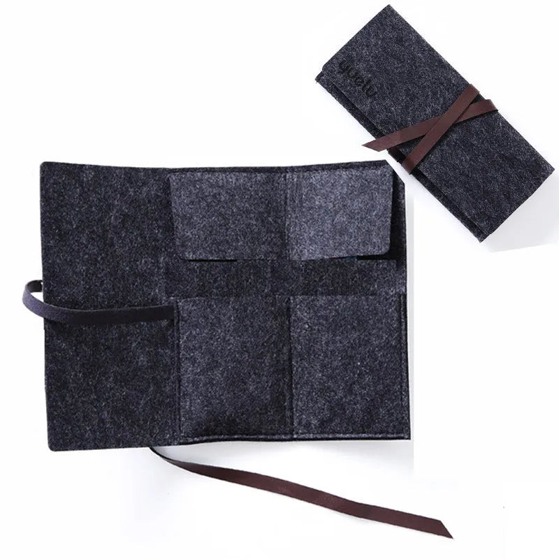 Scratch art pen tool kit with scraper, repair solution, brush, and bamboo stick on a craft table