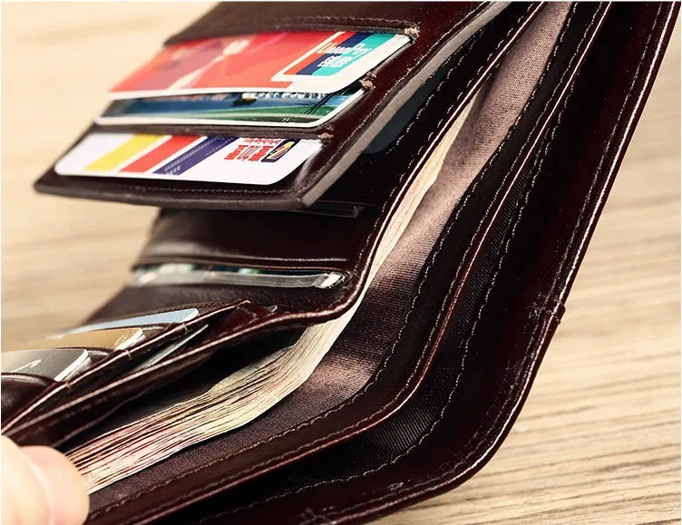 Men's leather wallet in black or brown showing internal compartments for cards, photos, banknotes, coins and documents