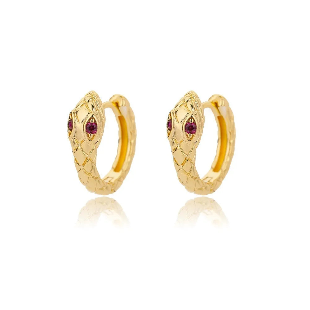 A pair of women's geometric butterfly earrings made from copper with heart, bow, and star shapes in a gold colour finish.