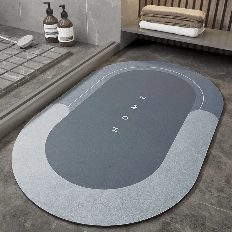 Blue oval blended fabric bathroom floor mat placed on tiled floor.