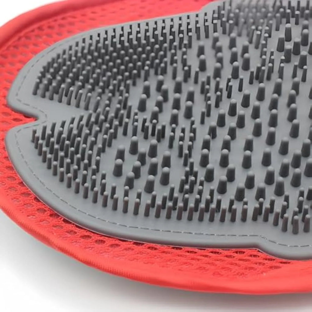 Red pet bathing glove with integrated cleaning brush showing adjustable design for left or right hand use