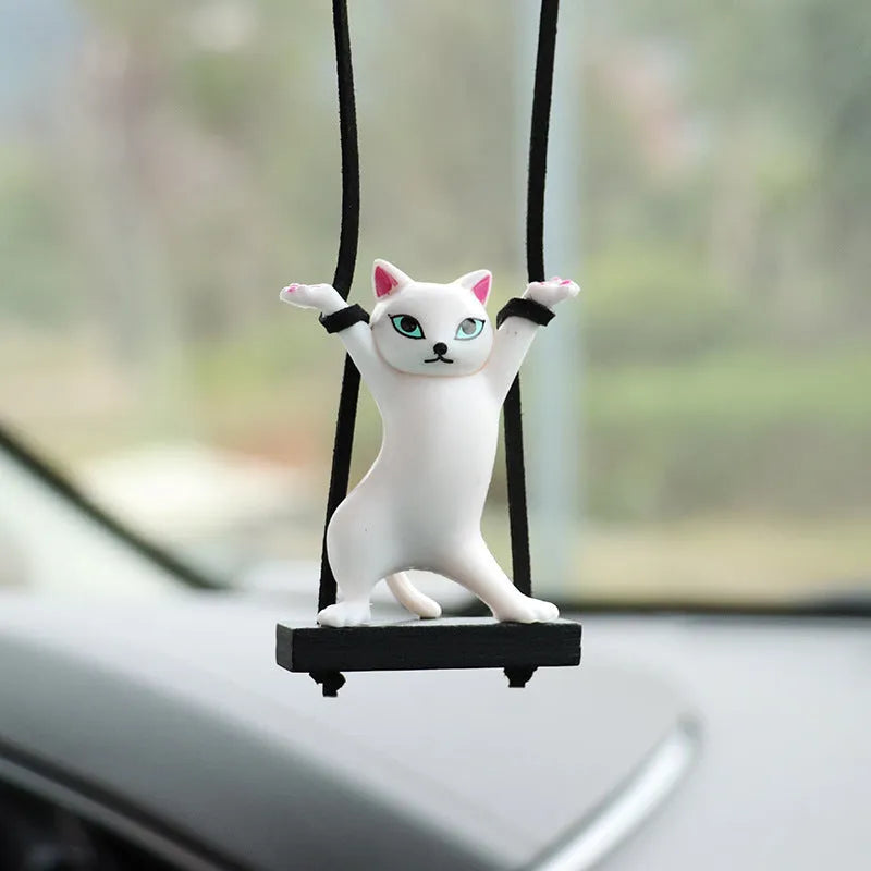 Cartoon-style resin cat pendant car ornament with adjustable rope in colour options including black, white, floral, grey, and brown.