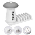 White USB charging station with five ports and built-in LED night light on wooden desk