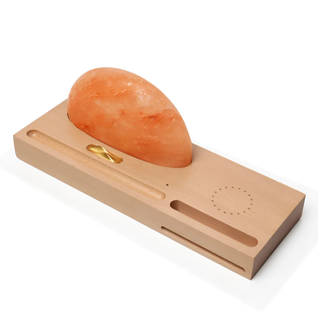 Natural crystal salt lamp on a beech wood base with integrated wireless phone charging pad.