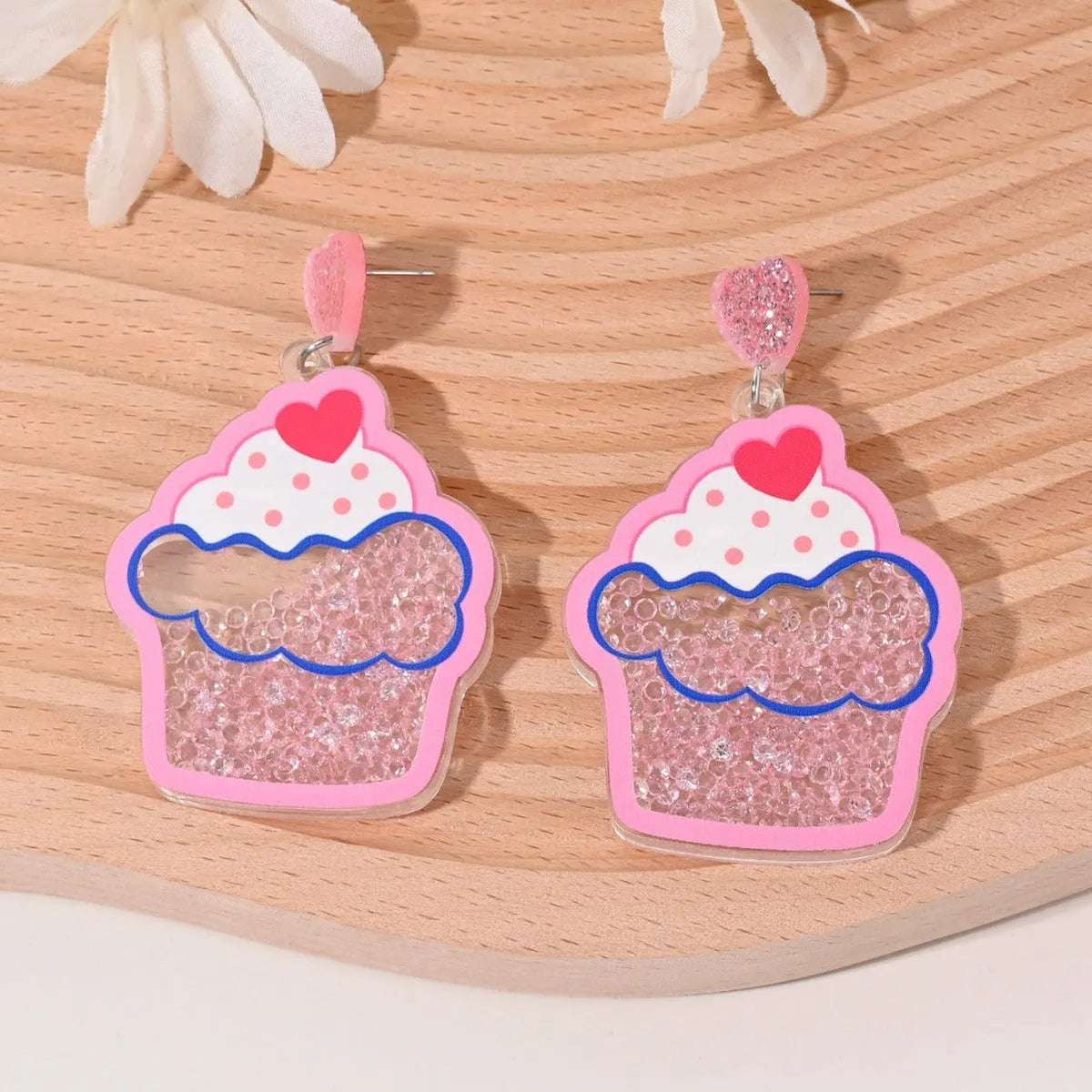 Colourful acrylic earrings shaped like cherry, strawberry, watermelon, pineapple, coconut tree, cake, and ice cream