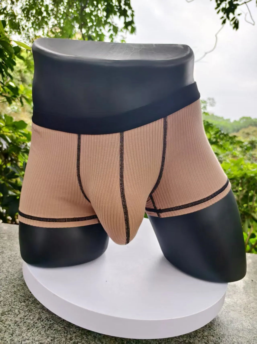 Men's solid colour boxers showing hip lifting and body shaping design in breathable fibre fabric
