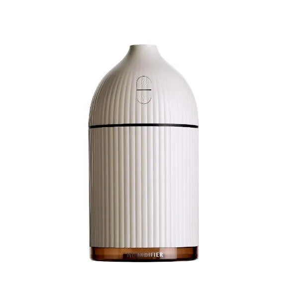 White ultrasonic aromatherapy diffuser humidifier with LED light and 300ml water bottle.