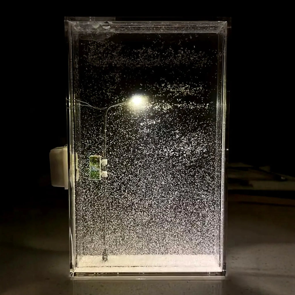 DIY snowy landscape night light kit showing components and assembled desktop decor with LED lights.