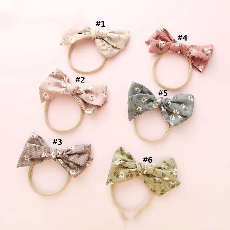 Children's knotted bow hair band in cloth with printed bow detail, Princess series Snow White style, six colours available