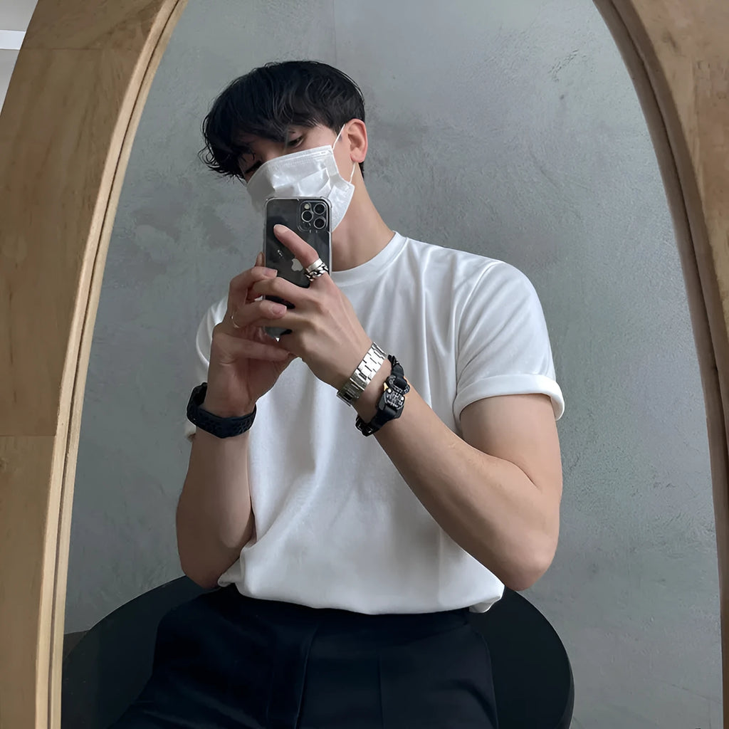 Men's slim-fit cotton t-shirt in white and black, showing round neck and half sleeves.