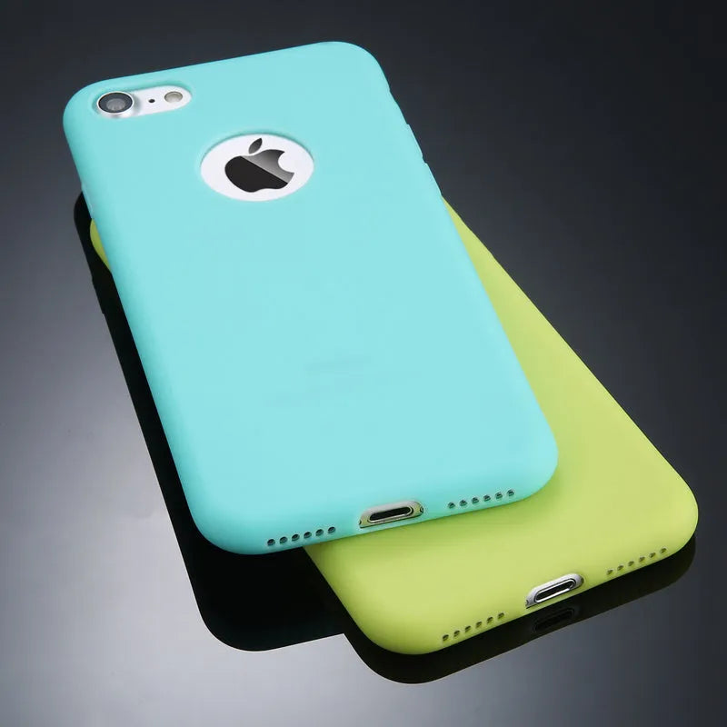 Plain soft silicone TPU phone case for iPhone in a candy colour on a table.