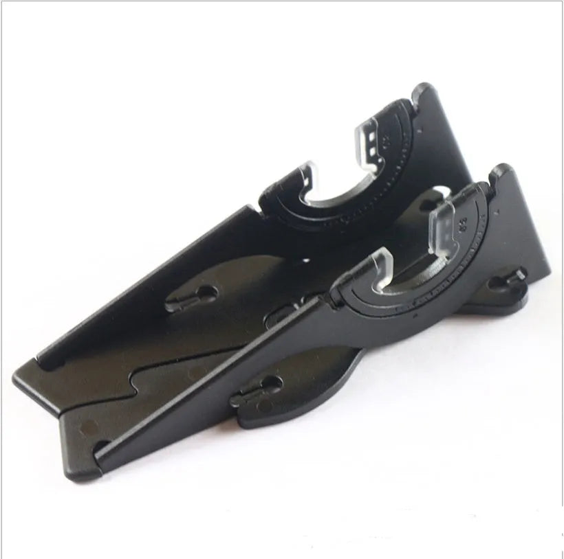 Plastic card type mobile phone holder in multiple colours on a desktop