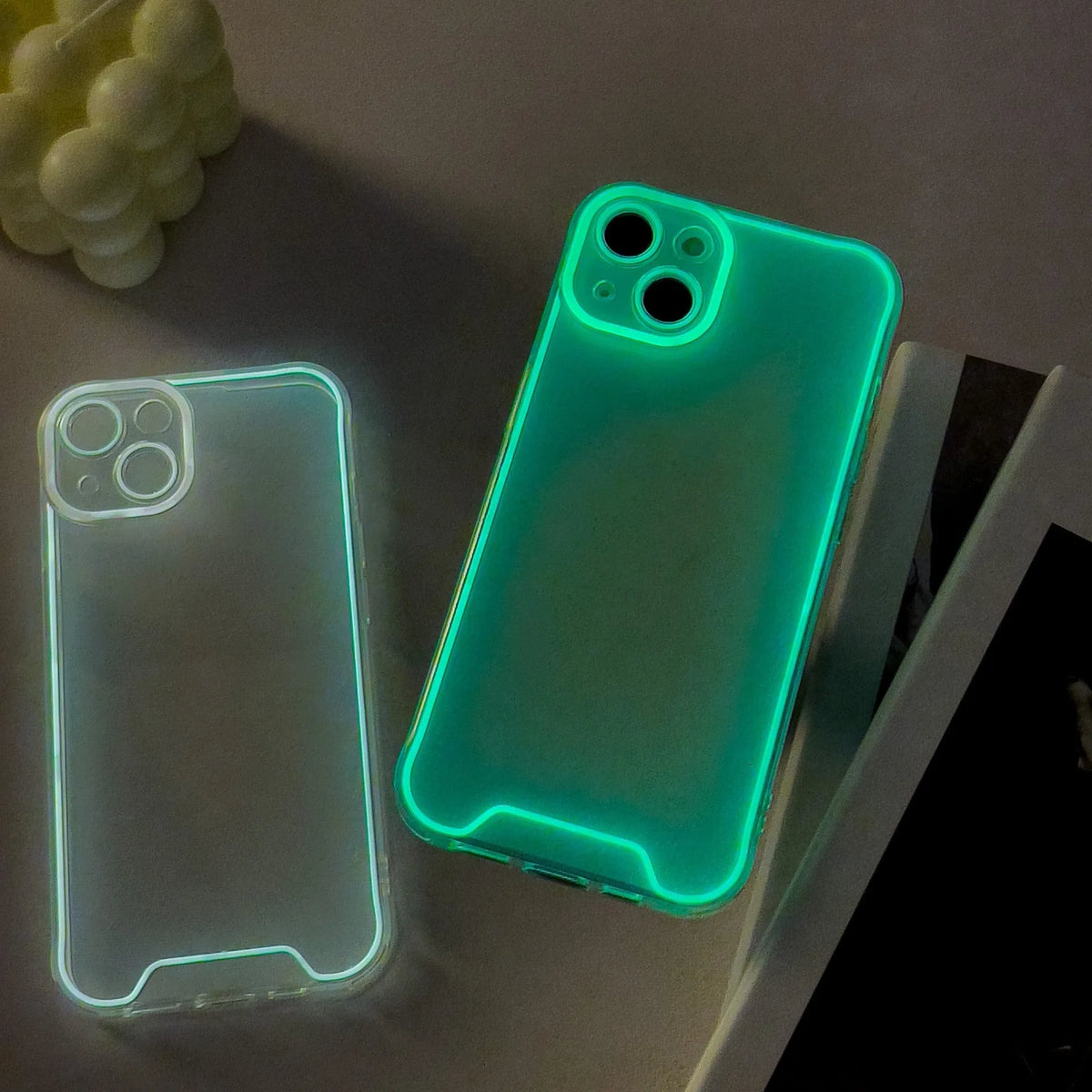 Glow in the dark Christmas phone case for iPhone in green, orange, blue, yellow, pink colours.