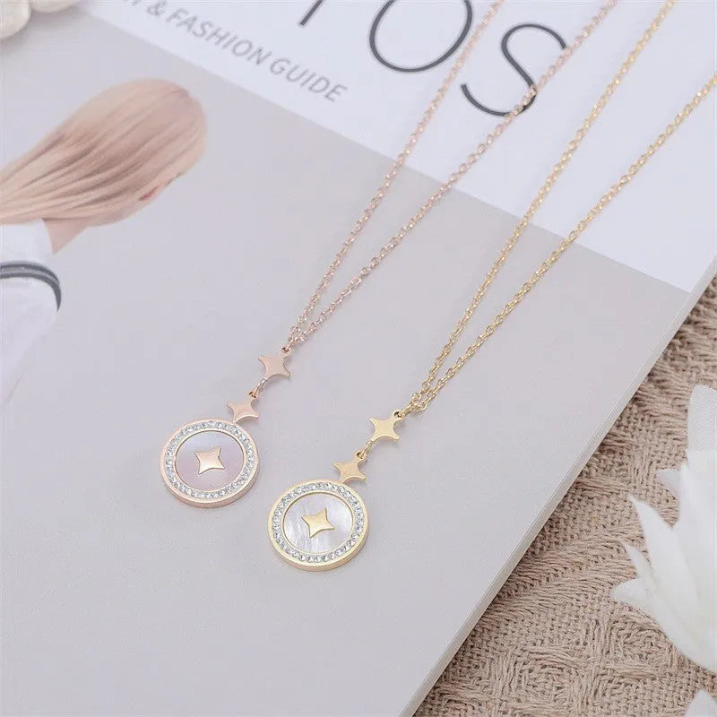 Gold titanium steel necklace with a geometric six-pointed star pendant on an O-ring chain.