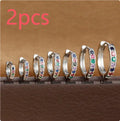 Set of three pairs of round zircon stud earrings showing gold colour, rose gold colour, and silver colour finishes.