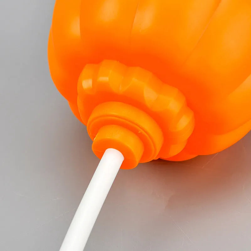 Plastic pumpkin lamp with yellow or purple light option, USB charging, 8.3cm wide by 22cm tall