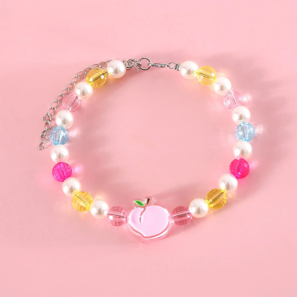 Colourful plastic bead pet necklace with small flower design on a adjustable strap.