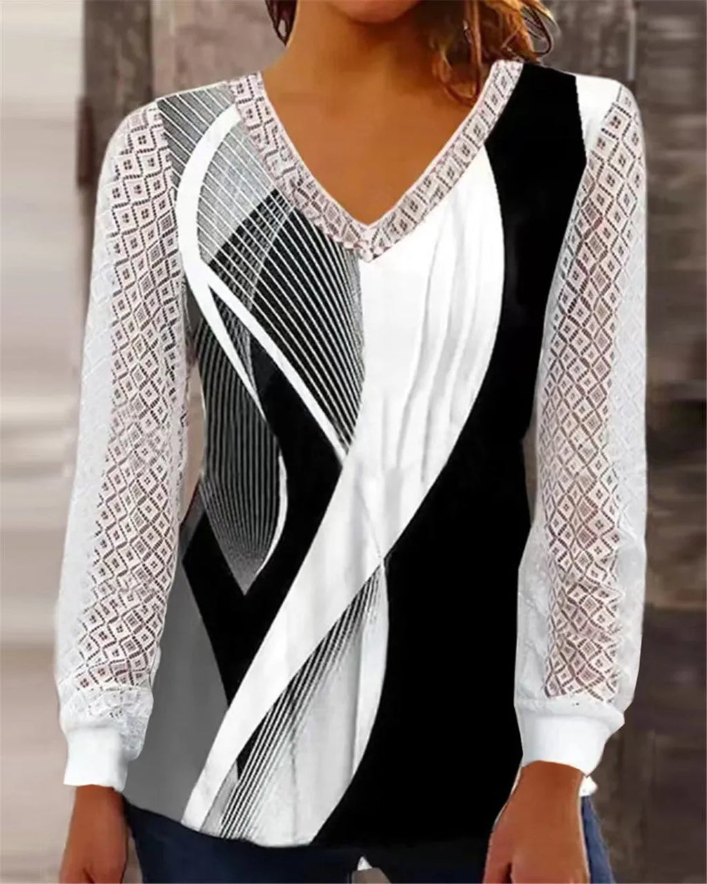 Purple loose V-neck women's top with hollow-out lace pattern and long sleeves.