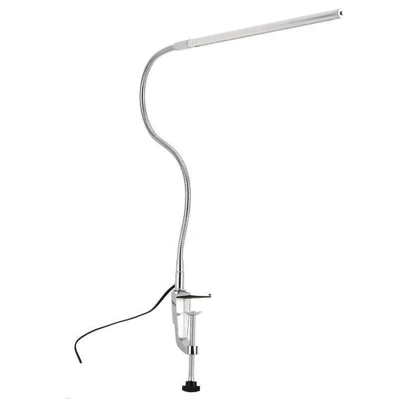 Silver LED clip-on table lamp with long adjustable arm for nail lighting and detailed work