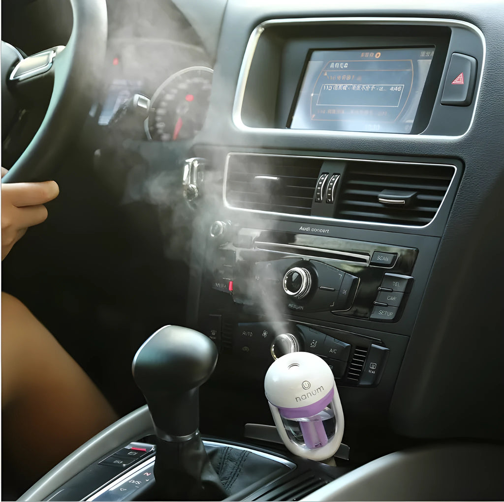 Compact blue car humidifier with 180 degree rotation spray for vehicle air quality improvement