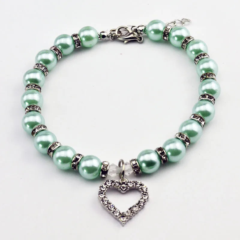 Pet pearl necklace with 10mm imitation pearls, 7mm rhinestone beads, alloy pendant, and white plated K detail