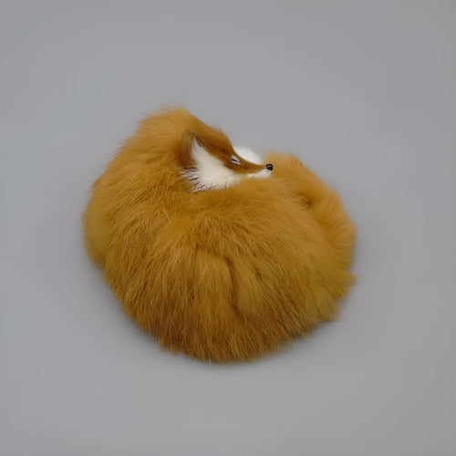 Artificial white fox fur handmade car decoration on a dashboard