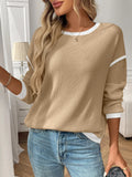 Women's loose fit polyester pullover top in light aqua blue with round neck and long sleeves.