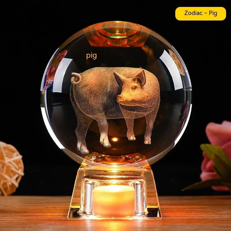 White crystal zodiac ornament with electronic luminous base showing Chinese animal design