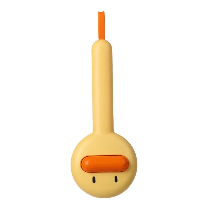 Small yellow duck-shaped pet comb with detachable needle teeth for cat and dog grooming.