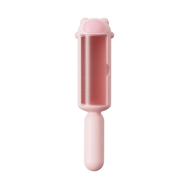 Blue pet hair remover with self-cleaning base on a fabric sofa