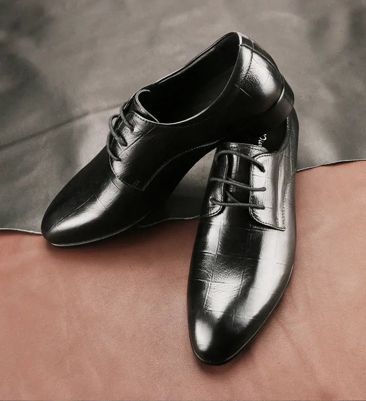 Men's black leather derby shoes with pointed toe, checkered sewing detail, and a rubber sole.