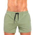 Men's solid colour swimming shorts with mesh lining for sports and fitness in Army Green.
