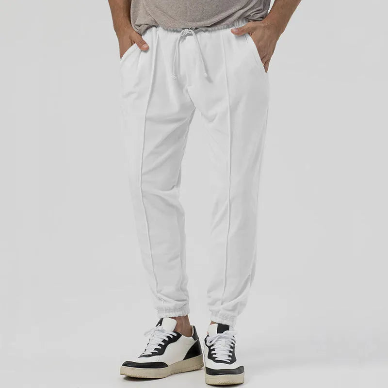 Men's gray cotton blend track sweatpants with loose tapered fit and straight-leg style