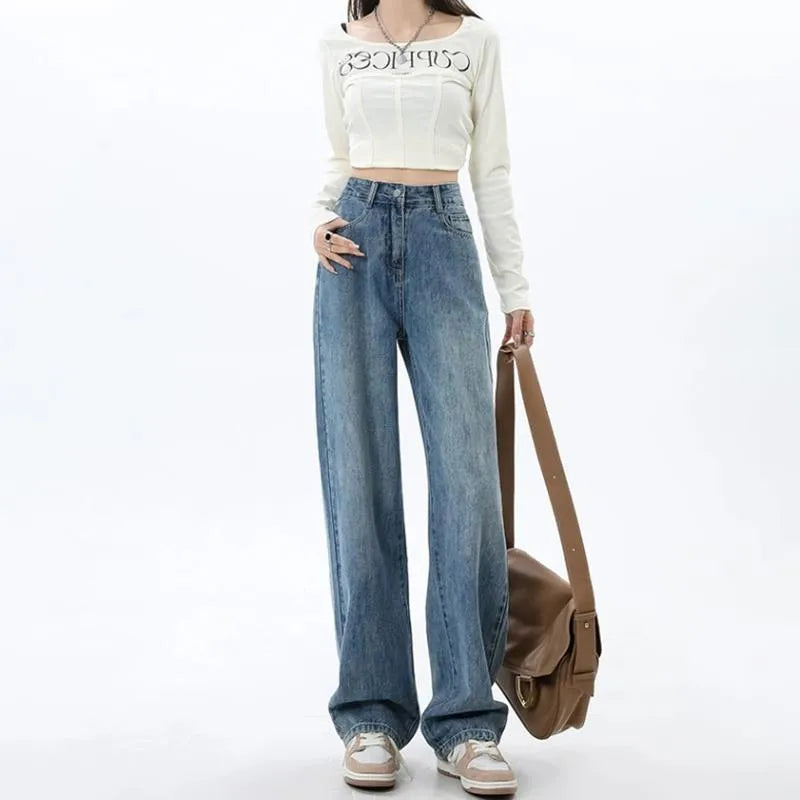 A woman wearing high-waisted retro blue wide-leg jeans made from stretch denim.
