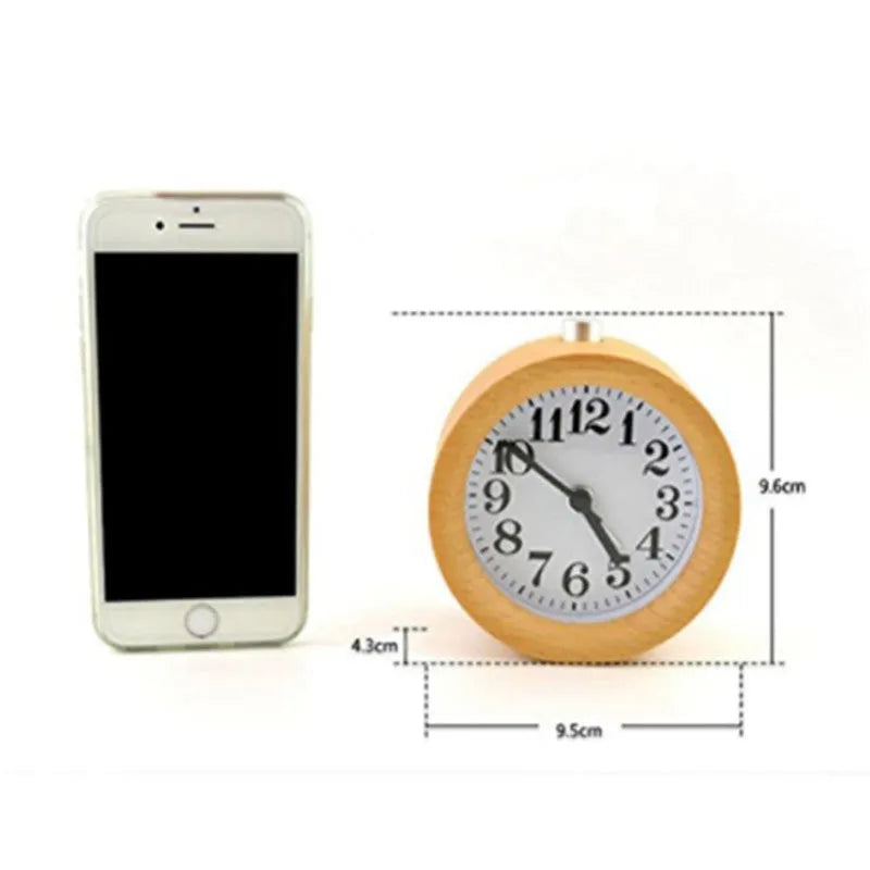 Solid beech wood silent snooze alarm clock showing wooden case, glass mirror face, and 9.5cm diameter