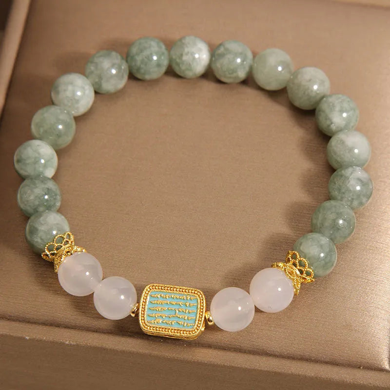 Women's crystal bracelet with oil green emerald stones and a scripture charm