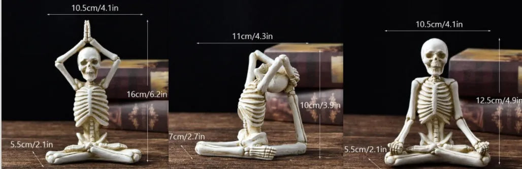 Detailed resin Halloween ornament of a yoga-posing skeleton skull on a desktop.