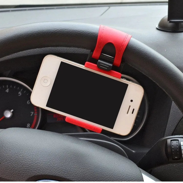 Black steering wheel phone holder mounted showing elastic clip and silicone phone padding